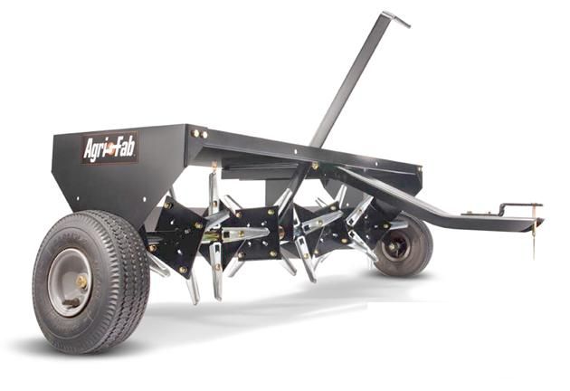 Hollow-tine core aerator machine showing plug removal tines